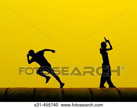 Woman shooting to the air as if indicating the start of a race, man starting to run View Large Photo Image Stock Image - Woman shooting to the air as if indicating the start of a race, man starting to run. Fotosearch