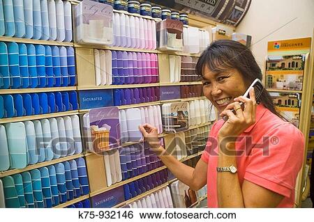 Woman shopping for paint View Large Photo Image Stock Photograph - Woman shopping for paint. Fotosearch