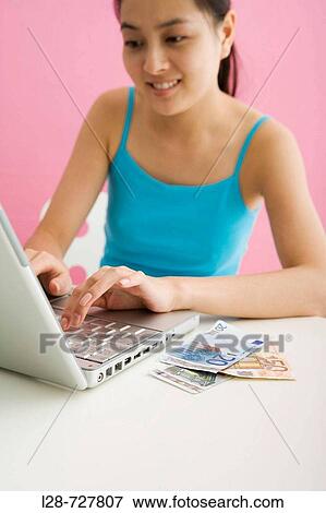 Woman shopping from internet View Large Photo Image Stock Photo - Woman shopping from internet. Fotosearch