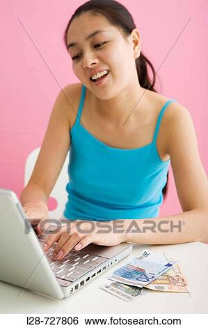 Stock Photograph - Woman shopping from internet. Fotosearch