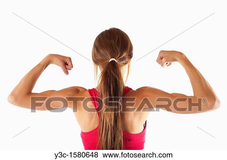 Woman showing muscular back and biceps View Large Photo Image Stock Photo - Woman showing muscular back and biceps. Fotosearch