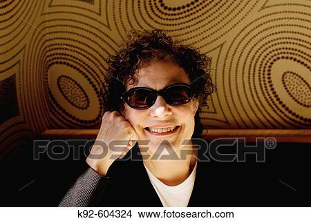 Woman sitting in a restaurant. View Large Photo Image Picture - Woman sitting in a restaurant.. Fotosearch