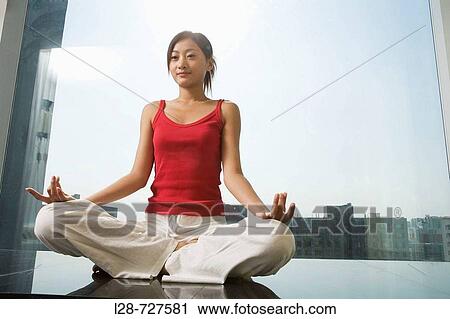 Woman sitting in yoga position on floor View Large Photo Image Stock Image - Woman sitting in yoga position on floor. Fotosearch