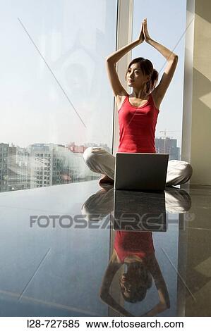 Woman sitting in yoga position on floor View Large Photo Image Stock Photography - Woman sitting in yoga position on floor. Fotosearch