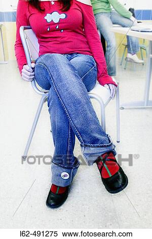 Woman sitting on a chair. View Large Photo Image Stock Photography - Woman sitting on a chair.. Fotosearch