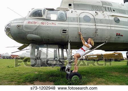 Woman sitting on a helicopter View Large Photo Image Stock Photo - Woman sitting on a helicopter. Fotosearch