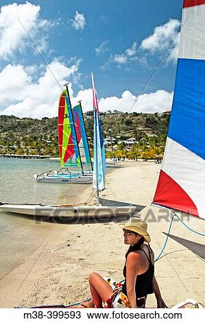 Woman sitting on a Hobie-cat. St. James Club, Antigua View Large Photo Image Stock Image - Woman sitting on a Hobie-cat. St. James Club, Antigua. Fotosearch