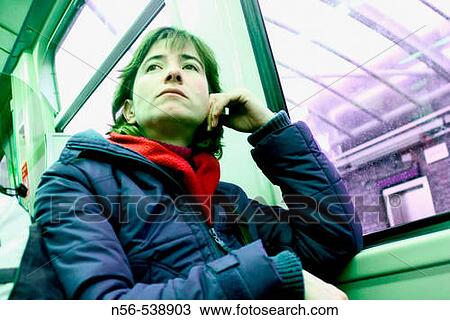 Woman sitting on a train. View Large Photo Image Stock Image - Woman sitting on a train.. Fotosearch