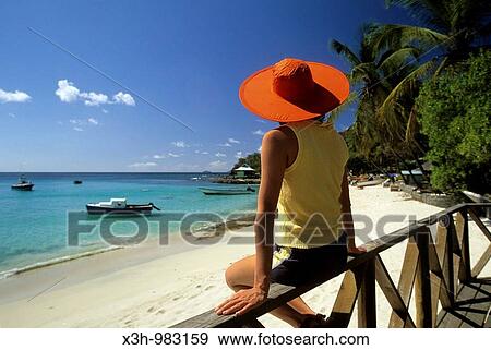 woman sitting on balustrade at Basil's bar, Mustik, Grenadines islands, Saint Vincent and the Grenadines, Winward Islands, Lesser Antilles, Caribbean Sea View Large Photo Image Stock Photo - woman sitting on balustrade at Basil's bar, Mustik, Grenadines islands, Saint Vincent and the Grenadines, Winward Islands, Lesser Antilles, Caribbean Sea. Fotosearch