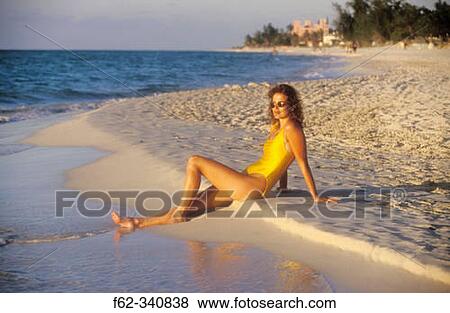 Woman sitting on beach looking out to sea at sunset. Varadero. Cuba View Large Photo Image Stock Photo - Woman sitting on beach looking out to sea at sunset. Varadero. Cuba. Fotosearch