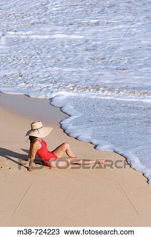 Woman sitting on beach, Maui, Hawaii, USA View Large Photo Image Stock Image - Woman sitting on beach, Maui, Hawaii, USA. Fotosearch