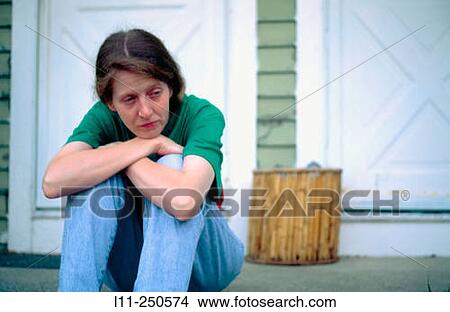 Woman sitting on doorstep View Large Photo Image Picture - Woman sitting on doorstep. Fotosearch