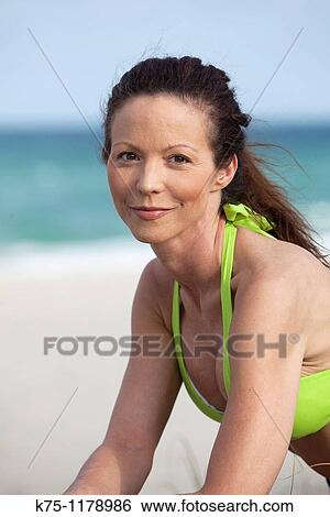 woman sitting on the beach View Large Photo Image Stock Photograph - woman sitting on the beach. Fotosearch