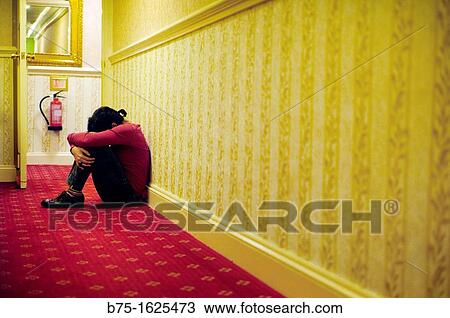 Woman sitting on the floor View Large Photo Image Stock Image - Woman sitting on the floor. Fotosearch