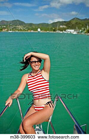 Woman sitting on the front of a catamaran in Antigua. Taken May 2004. Korean. View Large Photo Image Stock Image - Woman sitting on the front of a catamaran in Antigua. Taken May 2004. Korean.. Fotosearch