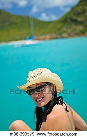 Woman sitting on the front of a catamaran, sailing in Antigua View Large Photo Image Stock Photo - Woman sitting on the front of a catamaran, sailing in Antigua. Fotosearch