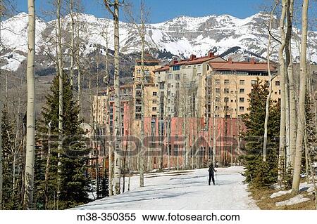 Woman skiing in Telluride, Colorado. Wyndham hotel in the background. USA View Large Photo Image Stock Photography - Woman skiing in Telluride, Colorado. Wyndham hotel in the background. USA. Fotosearch