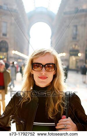 Woman smiling in Galleria Vittorio Emmanuelle II, Milano, Lombardia, Italy View Large Photo Image Stock Image - Woman smiling in Galleria Vittorio Emmanuelle II, Milano, Lombardia, Italy. Fotosearch