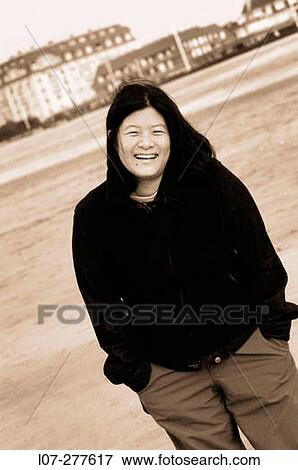 Woman smiling on the beach. Deauville. Normandy, France View Large Photo Image Stock Photo - Woman smiling on the beach. Deauville. Normandy, France. Fotosearch