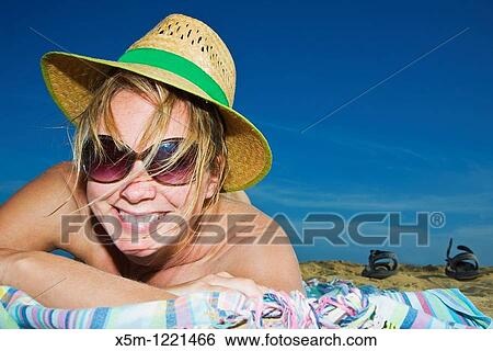 Woman smiling on the beach View Large Photo Image Stock Photograph - Woman smiling on the beach. Fotosearch