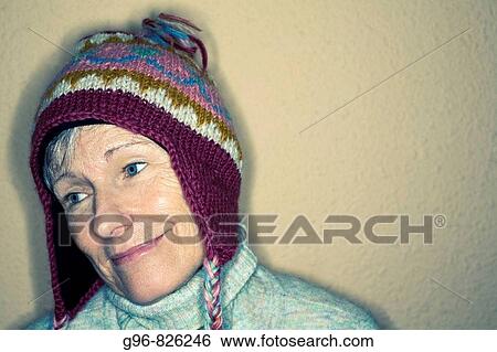 Stock Photograph - woman smiling with hat. Fotosearch