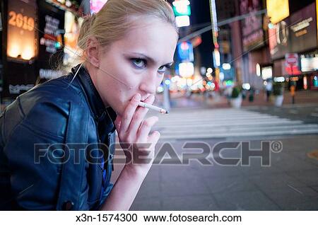 Woman smoking at night, New York City View Large Photo Image Stock Image - Woman smoking at night, New York City. Fotosearch