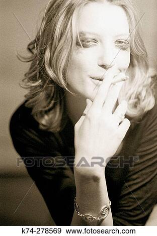 Woman smoking View Large Photo Image Stock Photo - Woman smoking. Fotosearch