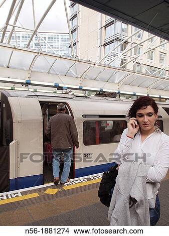 woman speaking in a tube station, Hamersmith, London View Large Photo Image Picture - woman speaking in a tube station, Hamersmith, London. Fotosearch