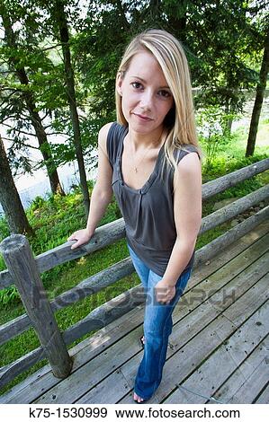 Woman standing on deck View Large Photo Image Stock Photo - Woman standing on deck. Fotosearch