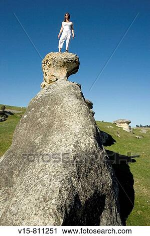 woman standing on rock View Large Photo Image Stock Image - woman standing on rock. Fotosearch