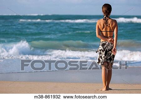 Woman standing on the beach Maui, Hawaii View Large Photo Image Stock Image - Woman standing on the beach Maui, Hawaii. Fotosearch