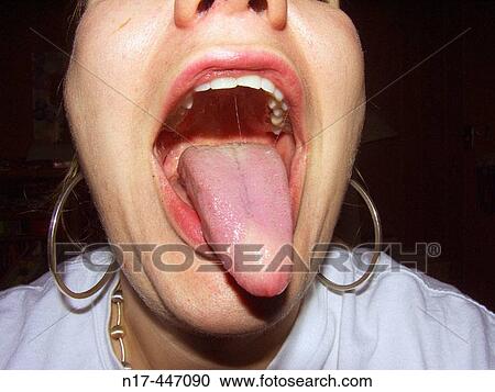 Woman sticking out tongue View Large Photo Image Stock Image - Woman sticking out tongue. Fotosearch