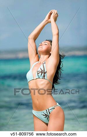 Woman stretching by the sea View Large Photo Image Stock Photograph - Woman stretching by the sea. Fotosearch