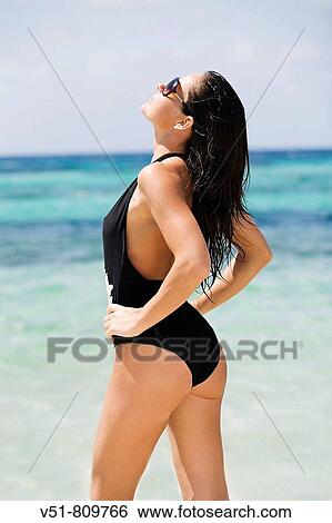 Woman stretching by the sea View Large Photo Image Stock Photograph - Woman stretching by the sea. Fotosearch