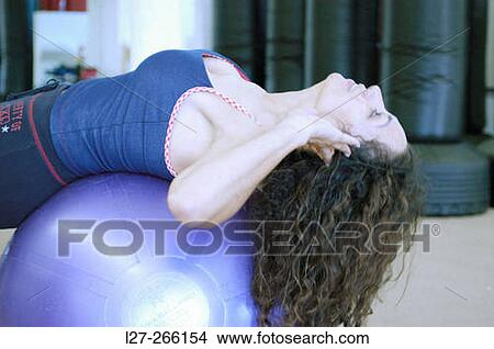 Picture - Woman stretching. Fotosearch