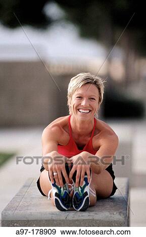 Woman stretching View Large Photo Image Stock Photo - Woman stretching. Fotosearch