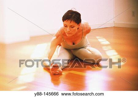 Stock Photograph - Woman stretching. Fotosearch