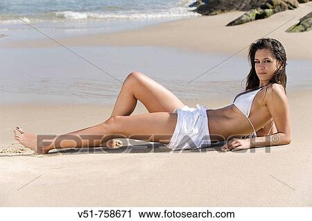 woman, sunbathing, beach, summer, young adult View Large Photo Image Stock Image - woman, sunbathing, beach, summer, young adult. Fotosearch