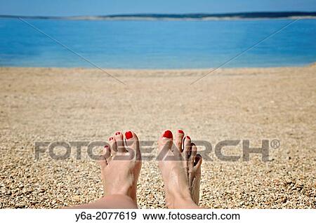 Woman sunbathing on beach, Island Pag, Croatia, Europe. View Large Photo Image Stock Photo - Woman sunbathing on beach, Island Pag, Croatia, Europe.. Fotosearch