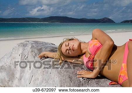 Woman sunbathing. Whitehaven Beach, Australia. View Large Photo Image Stock Photo - Woman sunbathing. Whitehaven Beach, Australia.. Fotosearch