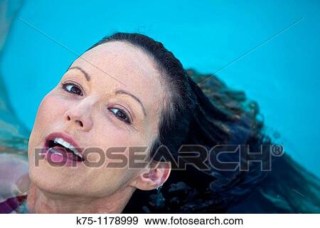 Woman surfacing from water close up View Large Photo Image Stock Photo - Woman surfacing from water close up. Fotosearch