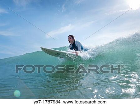 Woman surfing. View Large Photo Image Picture - Woman surfing.. Fotosearch