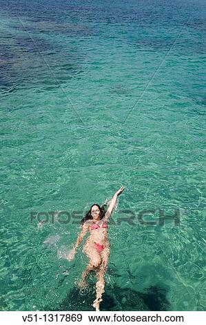 Woman swimming in Ibiza, Balearic Islands, Spain View Large Photo Image Stock Photo - Woman swimming in Ibiza, Balearic Islands, Spain. Fotosearch