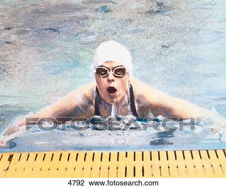 Woman swimming in pool View Large Photo Image Stock Image - Woman swimming in pool. Fotosearch