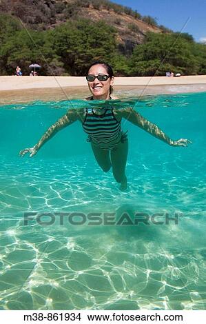 Woman swimming in the water Maui, Hawaii View Large Photo Image Picture - Woman swimming in the water Maui, Hawaii. Fotosearch