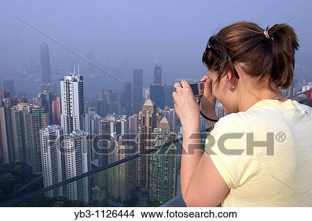 Woman Taking A Photograph, Viewing Platform, Victoria Peak, Hong Kong, China View Large Photo Image Picture - Woman Taking A Photograph, Viewing Platform, Victoria Peak, Hong Kong, China. Fotosearch