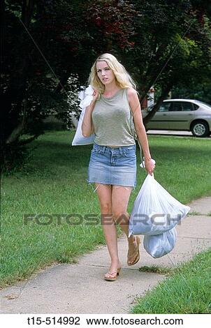 Woman taking out trash to curb side View Large Photo Image Stock Image - Woman taking out trash to curb side. Fotosearch