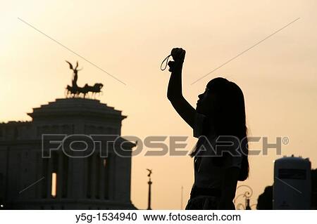 woman taking photograph on via dei fori imperiali street in rome italy View Large Photo Image Stock Image - woman taking photograph on via dei fori imperiali street in rome italy. Fotosearch