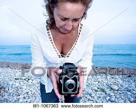 woman taking pictures View Large Photo Image Stock Image - woman taking pictures. Fotosearch
