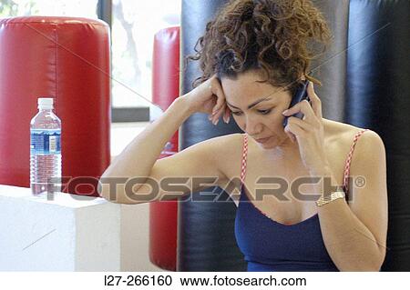 Stock Image - Woman talking on phone. Fotosearch